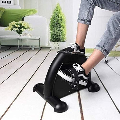 Person using a small exercise bike 